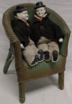 A pair of bisque and cloth figures of Laurel and Hardy,
