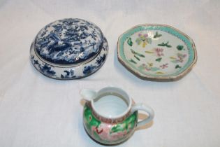 A 19th century Japanese circular jar and cover with blue and white figure and floral decoration