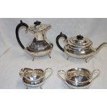 A George V silver four-piece tea and coffee set comprising an oval balluster-shaped coffee pot with