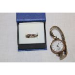 A ladies' 9ct gold wristwatch with expanding strap and a 9ct gold mounted eternity-style ring (2)