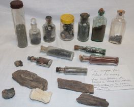 Various glass bottles containing tin samples from Wheal Vor Mines together with a small selection