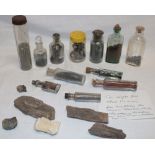 Various glass bottles containing tin samples from Wheal Vor Mines together with a small selection