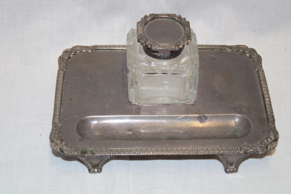 A late Victorian silver rectangular desk stand with decorated edge and cut-glass silver mounted