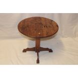 An unusual rustic oak circular occasional table,