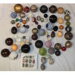 A selection of various polished stone eggs and spheres together with ceramic spheres and others etc.