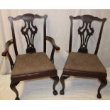 A set of four single and one carver mahogany Chippendale-style dining chairs with pierced vase
