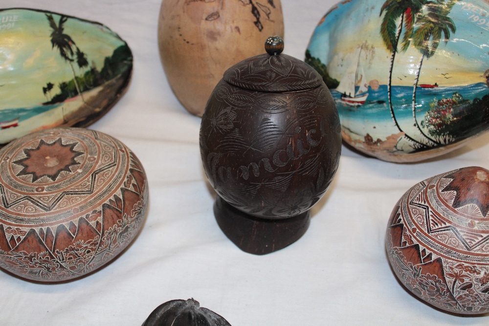 A carved coconut container and cover from Jamaica, two painted nuts from Belize, - Image 2 of 2