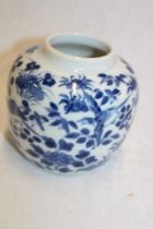 A 19th century Chinese circular ginger jar with blue and white bird and floral decoration,