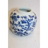 A 19th century Chinese circular ginger jar with blue and white bird and floral decoration,