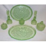 A good quality green tinted glass dressing table set comprising a pair of oval trays decorated with