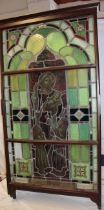 A 19th century Cornish stained glass window depicting the Messiah with children with base memorial