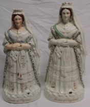 Two 19th century Staffordshire pottery figures "Queen of England" with varying colours and styles,