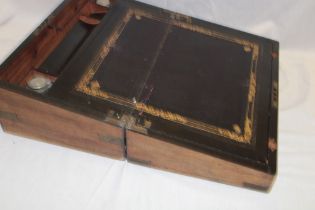 A Victorian brass mounted walnut rectangular writing slope with fitted interior and inkwells