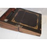 A Victorian brass mounted walnut rectangular writing slope with fitted interior and inkwells