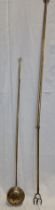 An old brass telescopic toasting fork,