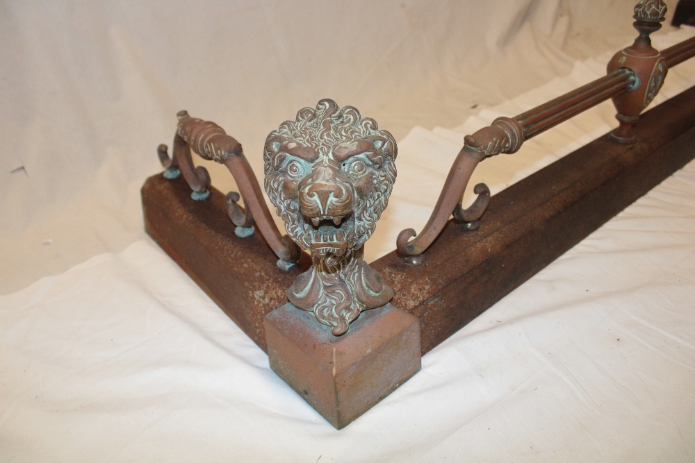 A Victorian brass mounted iron rectangular fire-fender with raised lion's mask decoration and - Image 3 of 3