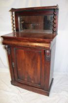 A small Victorian rosewood chiffonier with a single drawer in the frieze and cupboard enclosed by a