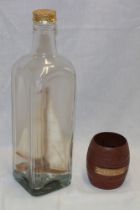 An unusual ship in a bottle figure of the sailing yacht "Seven Seas",