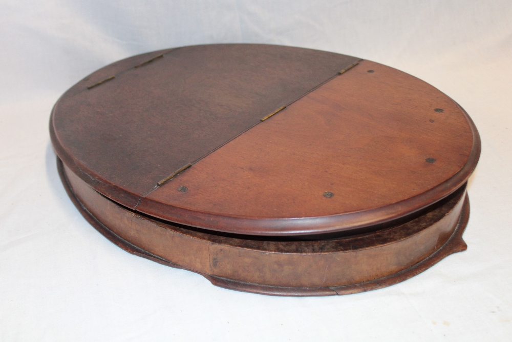 An old mahogany campaign-style folding oval toilet mirror 19" long overall - Image 2 of 2