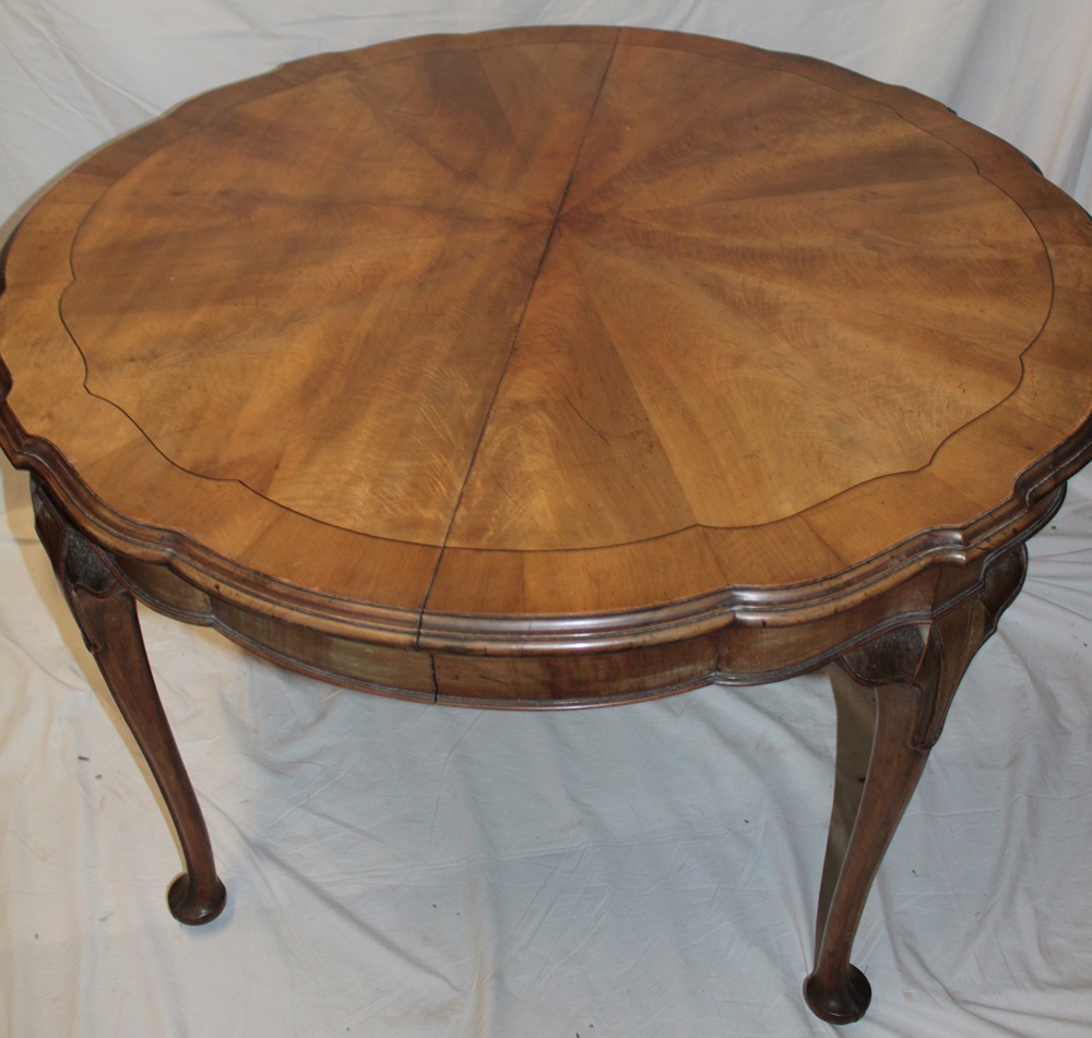 A 1920/30s walnut dining suite comprising a circular figured walnut dining table on cabriole legs, - Image 2 of 2