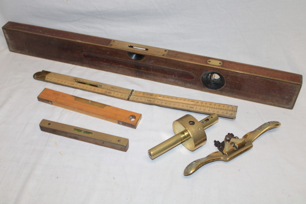 An old brass mounted mahogany spirit level by Stanley,