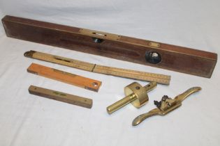 An old brass mounted mahogany spirit level by Stanley,