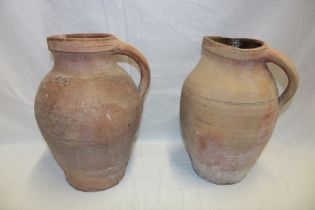 Two various old terracotta water jugs,