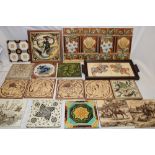 A selection of 19th century ceramic tiles including Jackfield female and swan decorated tile,