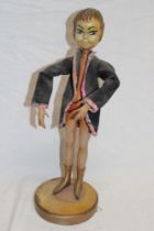 An unusual shop window articulated display mannequin in the form of a goblin on circular base,