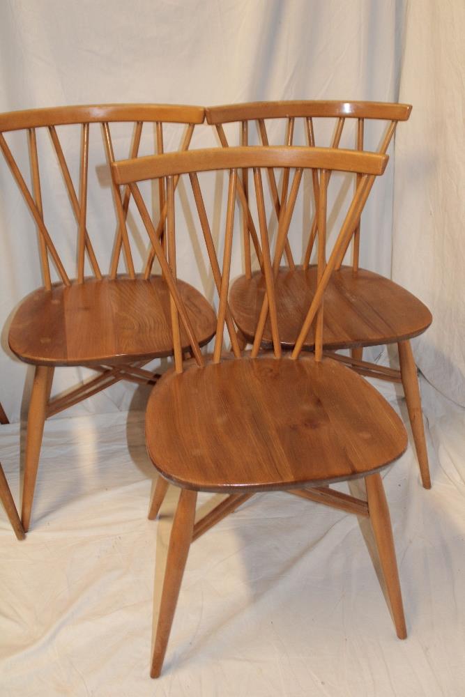 Three 1960's/70's Ercol pale elm dining chairs with crossed spindle-backs and shaped seats on - Image 2 of 4