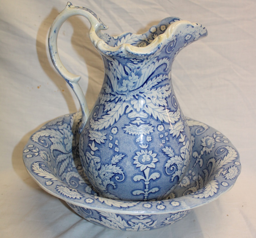 A 19th century Staffordshire pottery baluster-shaped water jug with blue and white floral