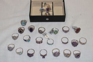 A jewellery box containing 25 various silver dress rings set semi-precious gemstones