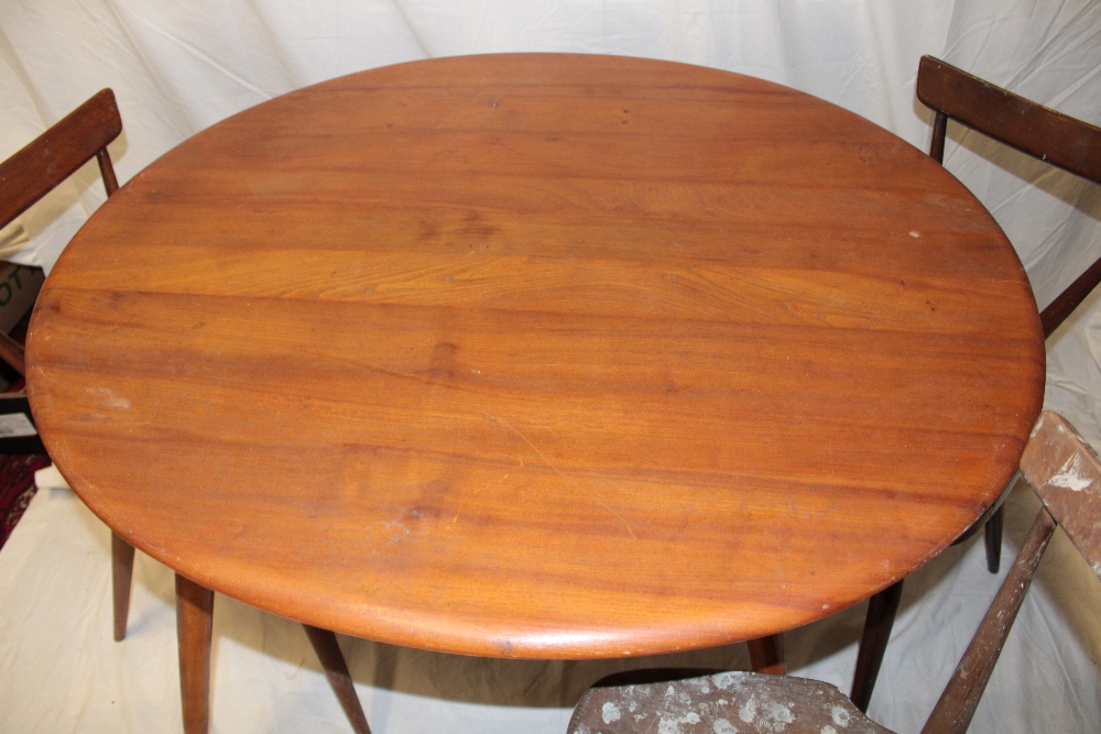 A 1960's Ercol pale elm circular dining table 35½" diameter (af) together with a set of four Ercol - Image 2 of 3