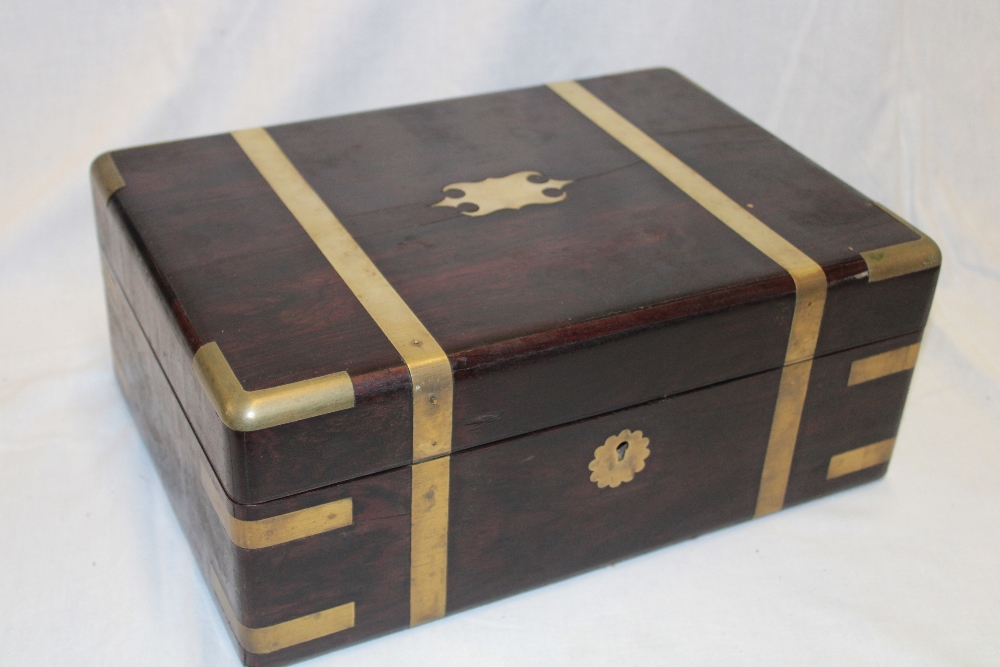 A 19th century brass mounted rosewood rectangular writing box with fitted interior and part