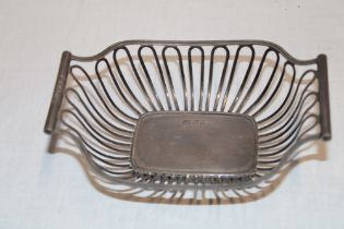 An Edward VII silver shaped-rectangular basket with pierced decoration, 5½" long,