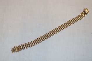 A 9ct gold flat-link bracelet (12.