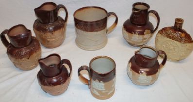 A selection of stoneware harvest pattern pottery including a large 19th century harvest pattern