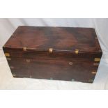 A brass mounted camphor rectangular trunk with hinged lid and brass handles 38" long