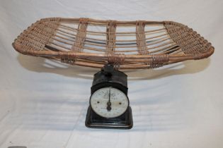 A Boots family scale to weigh 200 lbs by 1 oz with wicker platform basket