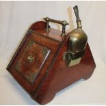 A Victorian brass mounted mahogany coal box with hinged sloping front,