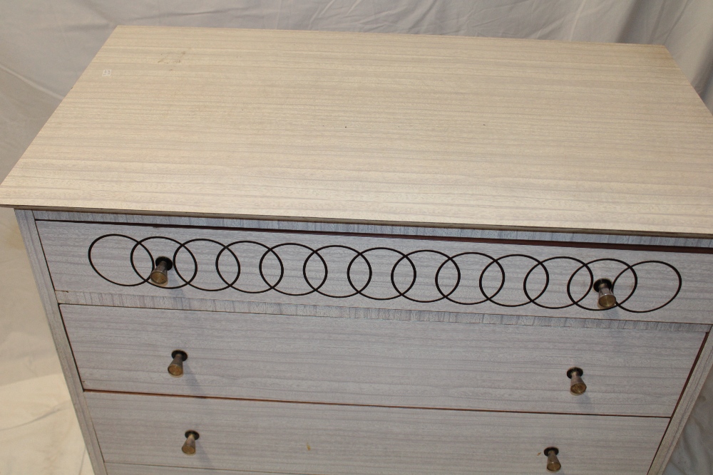 A 1950's/60's formica chest of four long drawers with brass handles, - Image 2 of 2
