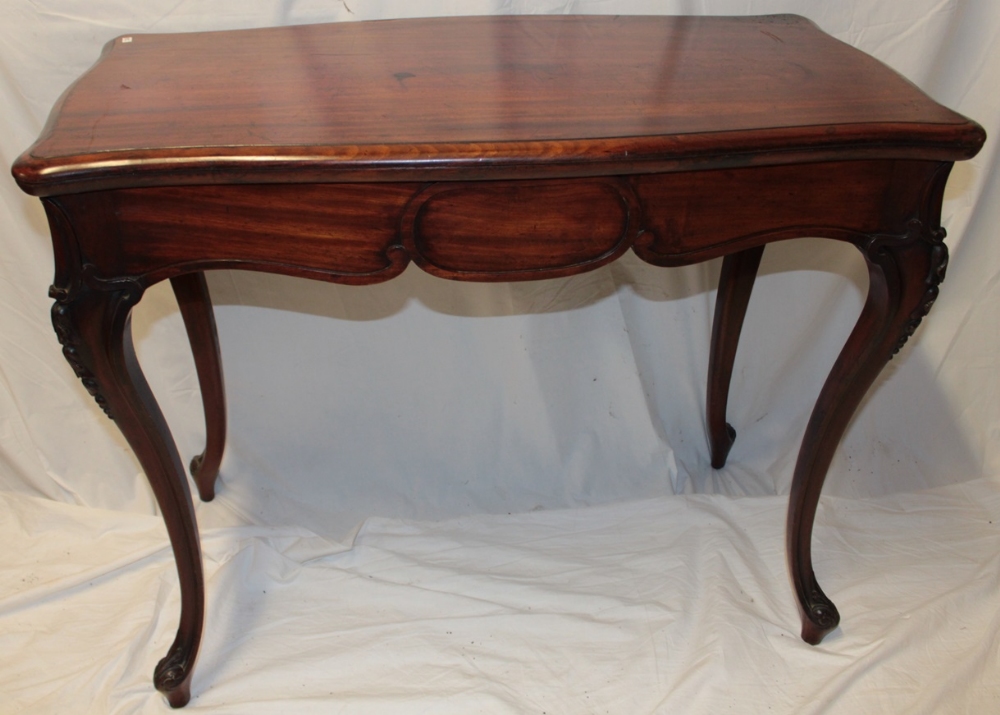 A late Victorian/Edwardian mahogany rectangular turn-over-top card table with baize lined playing