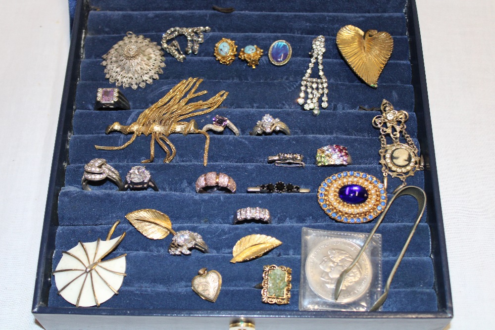 A jewellery box containing a quantity of various costume jewellery including dress rings,