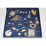 A jewellery box containing a quantity of various costume jewellery including dress rings,