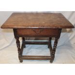 An 18th century oak rectangular side table with a single drawer in the frieze on bobbin turned legs,