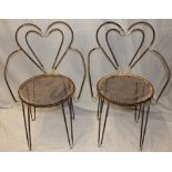 A pair of unusual 1960's iron occasional chairs by Mathieu Mategot with heart-shaped backs and
