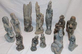 A selection of various African carved stone and composition figures including bust figure with