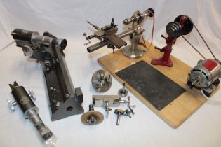 A jeweller's/watchmaker's lathe with accessories together with a jeweller's magnifier by C.