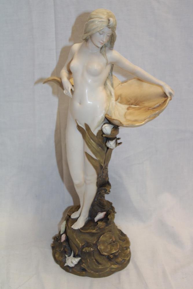 An Austrian Vienna china figure of an Art Nouveau nude female holding a lily pad by Ernst Wahliss,