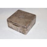 A George V silver square cigarette box with engine turned decoration,